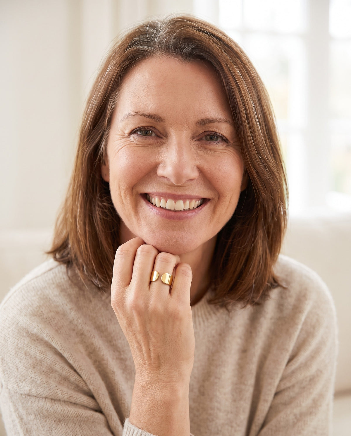 Woman wearing the gold Magneva Ember Ring